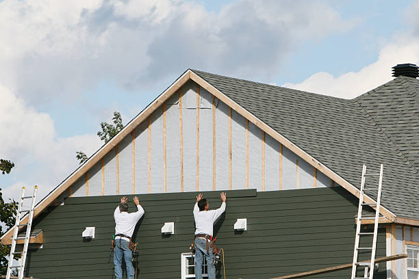 Professional Emergency Siding Repair technician working in Hyde Park, MA
